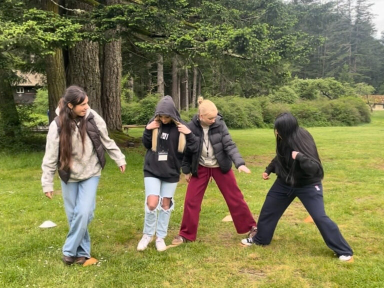 Group of teens doing a team building activity at Moment of Youth Summit 2026